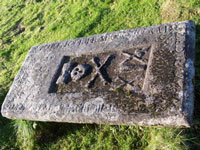 A tomb stone at church of St Columba’s by Skeabost on Skye A tomb stone at church of St Columba’s by Skeabost on Skye
